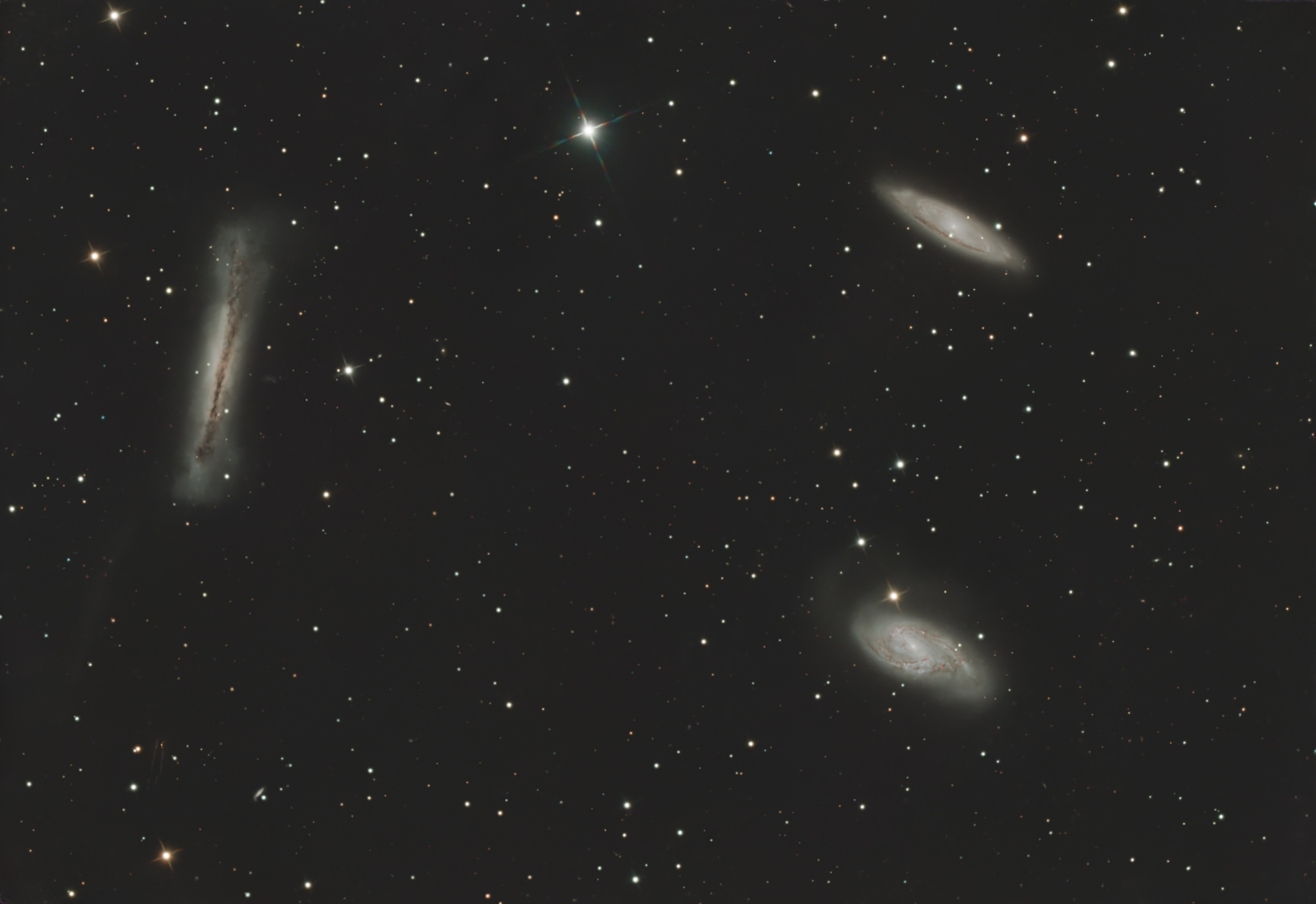 The Leo Triplet (also known as the M66 Group) is a small group of galaxies about 35 million light-years away in the constellation Leo. This galaxy group consists of the spiral galaxies M65, M66, and NGC 3628.